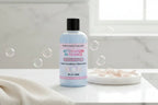 Body wash bottle labeled 'Afternoon in France' with a pink label on a white background