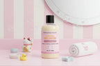 Bottle of Lemon Macaron body wash with pink label on a white background