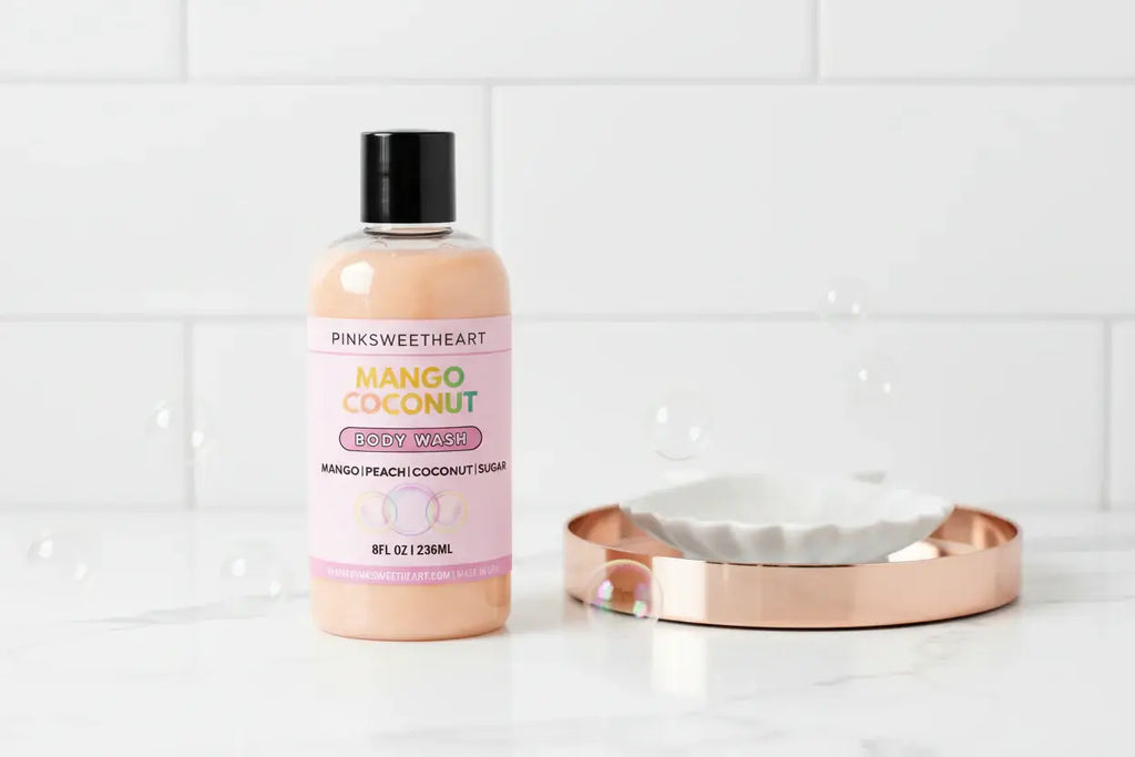 Body wash bottle labeled 'Pinksweetheart Mango Coconut' on a white background