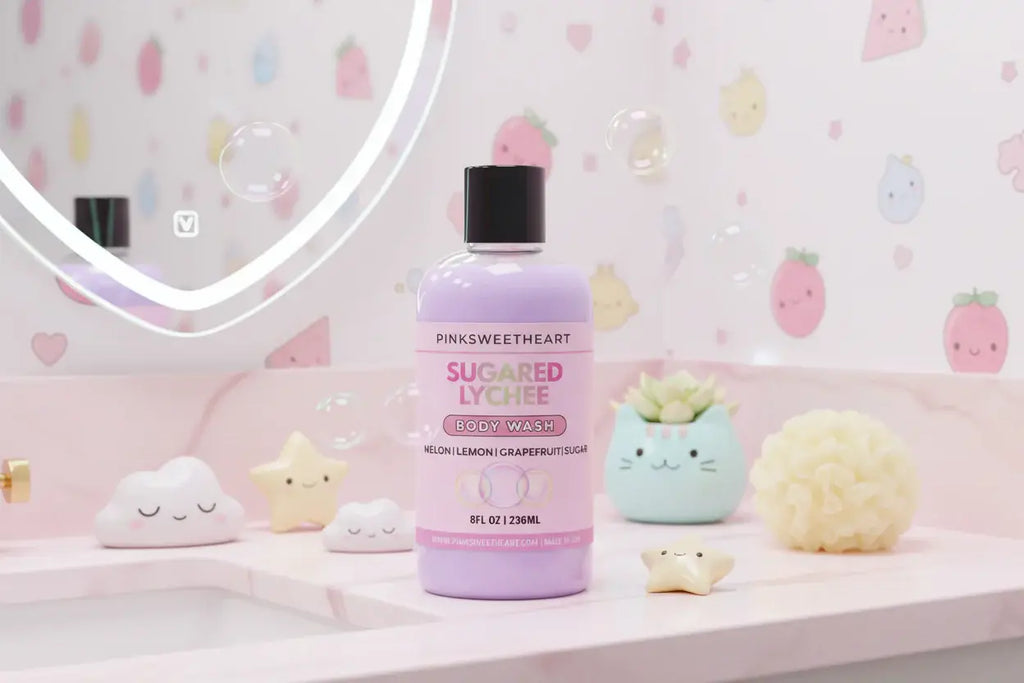Bottle of Sugared Lychee body wash on a pink vanity with decorative items.