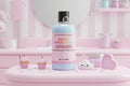 Bottle of 'Pink Sweetheart' Sweet Sugar Rush Marshmallow Pearl Lotion on a pink surface with decorative items.